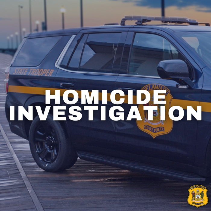 White "Homicide Investigation" with a DSP patrol Tahoe in the background