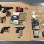 Evidence consisting of guns, drugs, drug paraphernalia, and money.