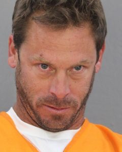 Justin Glowacki mugshot photo with gray background