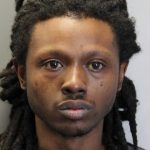 Dionne Warner's mugshot photo with gray background