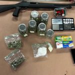 Photo of drug, paraphernalia, and firearm collected from search warrant