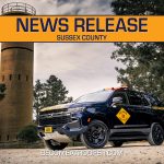 Graphic titled “News Release Sussex County” featuring a Delaware State Police Chevrolet Tahoe parked with the World War II watch tower in the background at Cape Henlopen State Park. A silhouette map of Delaware appears on the left with Sussex County highlighted in blue, the text “BecomeATrooper.com” on the bottom center, and social media icons are shown at the bottom right corner.