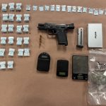 Image of the heroin, firearm, ammunition, marijuana, digital scales, and related paraphernalia recovered during the search warrant.