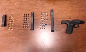 Image of the handgun and large capacity magazines recovered from Church