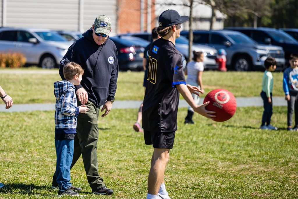 Delaware State Police, Greater Dover Boys & Girls Club and CR High School Baseball participate in kickball game.