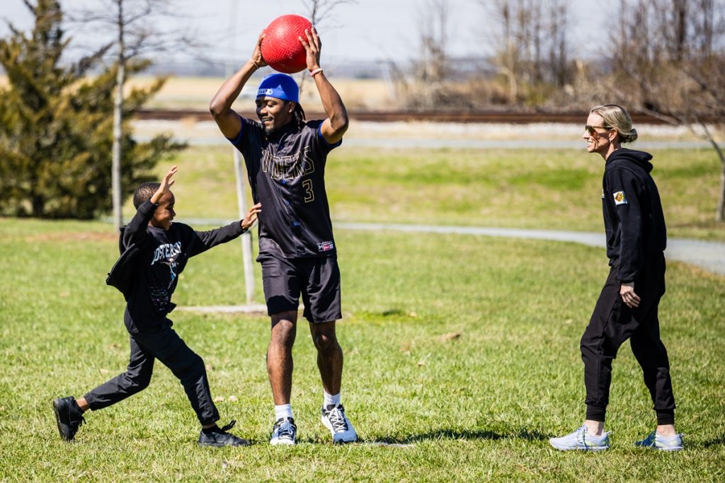 Delaware State Police, Greater Dover Boys & Girls Club and CR High School Baseball participate in kickball game.